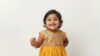 indian toddler wearing a festive dress